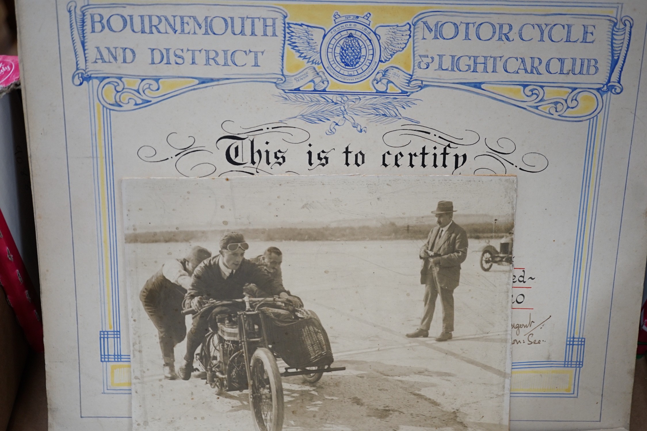Four circular bronze British Motorcycle Racing Club plaques and related material
